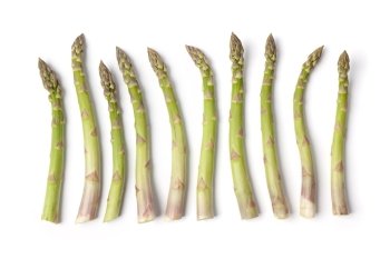 Fresh green Asparagus stalks on a row solated on white background