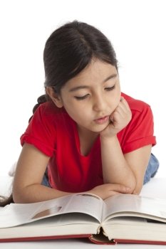  Eight year old girl reading a book 