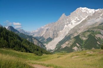 summer view Mont Blanc massif from Ferret valley, Courmayeur, Italy. Photo taken with polarized filter