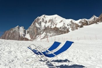 chairs on the glacier with Mont Blanc on background
