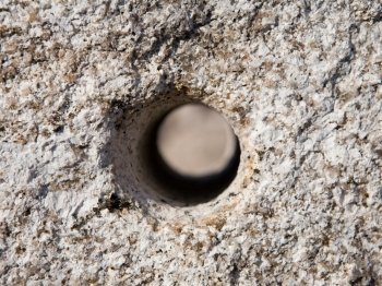 Hole drilled trough a stone