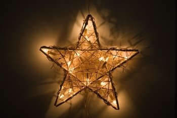 Lit decoration star hanging on a wall