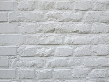 Detail of white brick wall useful as a background. Brick wall
