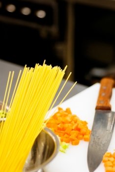 italian spaghetti pasta on a typical full equipped restaurant kitchen