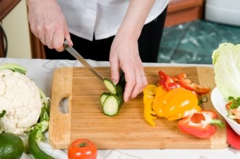 Cutting of vegetables on a chopping board