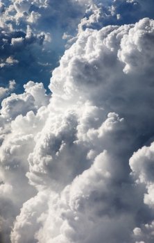 A cloud background with puffy white clouds, taken from above
