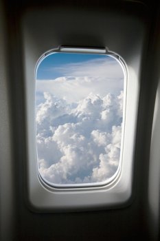 A view of clouds from an airplane window.