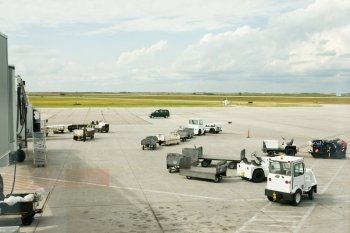 Baggage cars at an airport terminal.