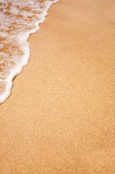 White foam on a beach - background texture