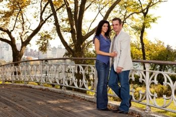A happy couple relaxing in a park in New York