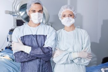 Portrait of young confident surgeons in operation theatre