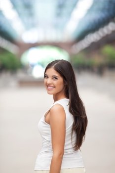 Attractive young female smiling while looking back