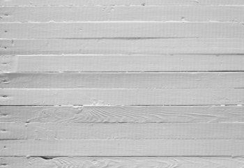 A background of weathered white painted wood