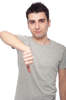 handsome young man with thumbs down on an isolated white background