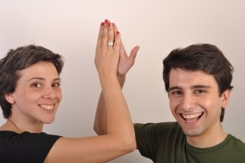 happiness between sister and brother giving each other high five