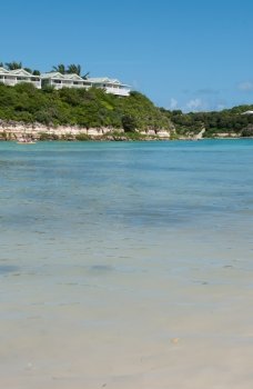 tropical beach and resort villas along the coast in Long Bay, Antigua