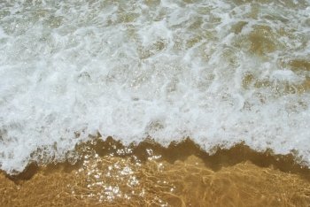 photo of ocean’s water on a beautiful beach