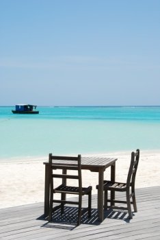 beautiful photo of a tropical view at a beach bar in a maldivian island