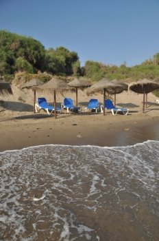 gorgeous beach view in Costa del Sol (Marbella) with umbrellas and chairs, Spain
