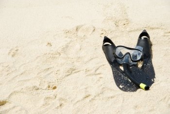 beautiful sand background with snorkeling equipment