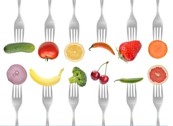 vegetables and fruits on the collection of forks, diet concept