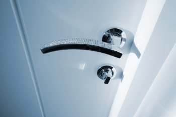 white door with the new metal handle