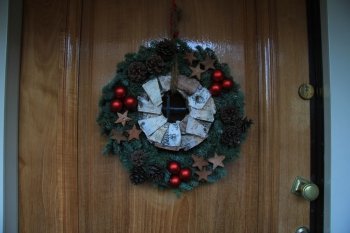 christmas wreath with decorations on a door