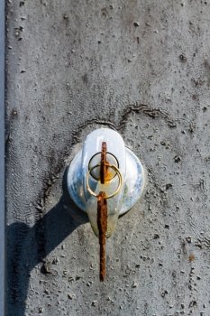 Close-up shot of an old rusty key inside a keyhole