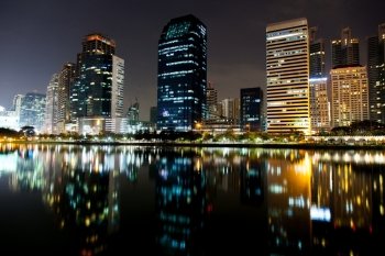 Tallest building in Bangkok, at night. There are various colors of light. Light reflected from the water front.
