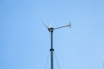 Wind turbine to produce electricity with wind. Installed alongside the sea.