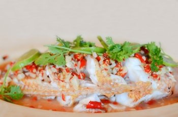 Steamed  fish with   lemon and chili ,  hot and spicy