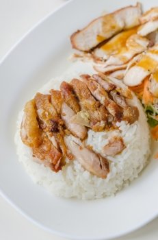 fried Chicken with  rice . close up fried Chicken over steamed rice on plate