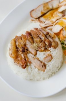 fried Chicken with  rice . close up fried Chicken over steamed rice on plate