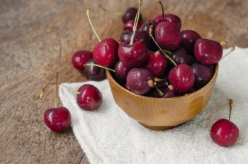 cherry fruits. fresh cherries on wooden table  background
