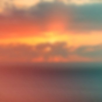 Blurred sunset sky over the sea in vintage style