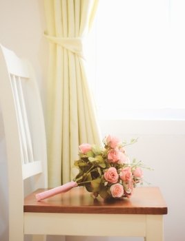 Bouquet of flower on chair for interior room with retro filter style