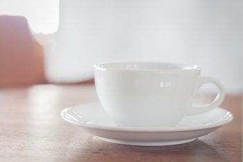 White coffee cup in coffee shop, stock photo