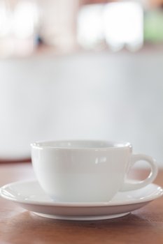 White mug on wooden table, stock photo