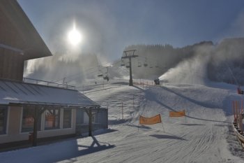 HDR photo of ski resort with lifts at snowy sunny day