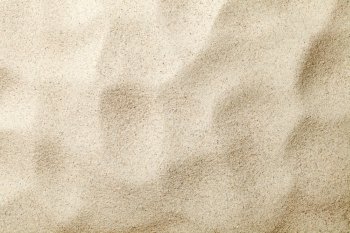 Sandy background. Summer beach texture. Top view. Copy space