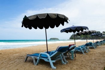 chairs & umbrellas on the beach at Phuket, Thailand