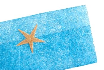 Blue envelope made of blue straw mesh  with sea star decoration on white background.