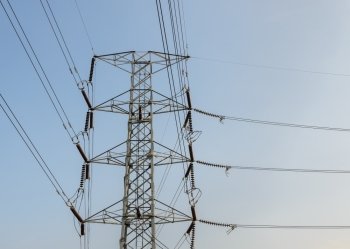 Electricity pylon or transmission tower in blue sky