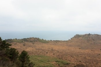 crater with blue sea on Jeju Island South Korea