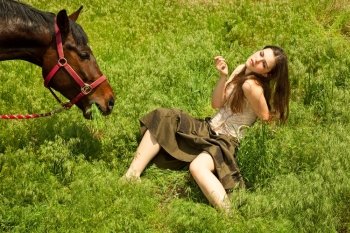 portraite of attractive girl and horse. outdoor shot