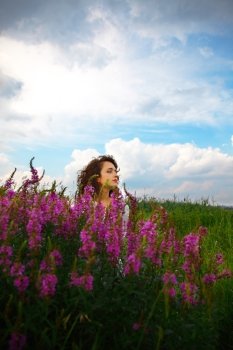 attractive girl with vivid flowers. outdoor shot
