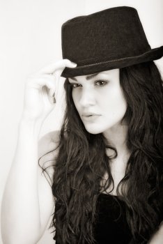 portrait of attractive girl in hat. Studio shot