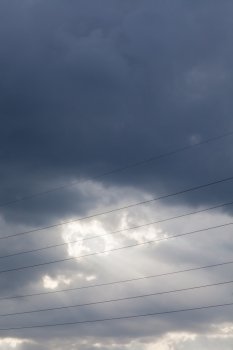 beautiful sky background with clouds and rays and wires