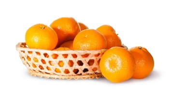 Ripe Sweet Tangerines In Wicker Basket Isolated On White Background