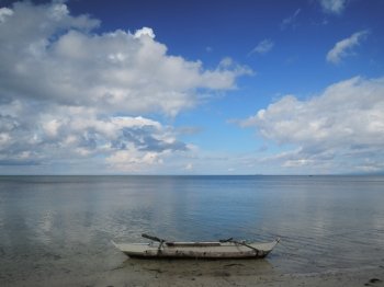Siquijor Dreams. Traditional Filipino boat (Banca) on the beach